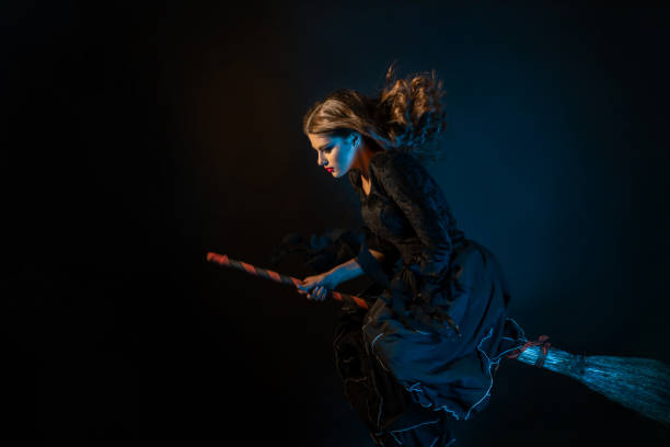 istock A young witch is rushing to the sabbath. A young beautiful brunette 1347533294