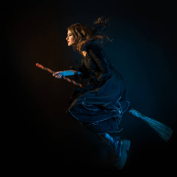 istock A beautiful witch on a broomstick is flying to the sabbath. 1347533298