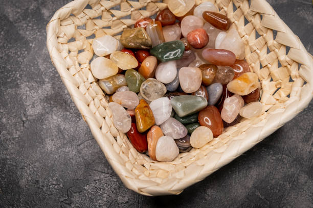 Different shapes sea rock pebbles. Colorful rocks. Semi precious gem stones collection. Close up of different kinds of stones in a variety of colours. Texture of different types of stones. Gemstones
