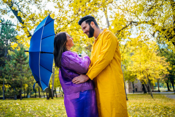 istock Love couple in raincoats 1347535003
