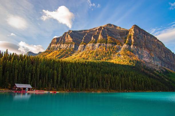 istock Sunlit Mountains At Lake Louise 1347535091