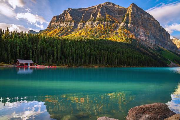 istock Sunlit Mountains At Lake Louise 1347535113