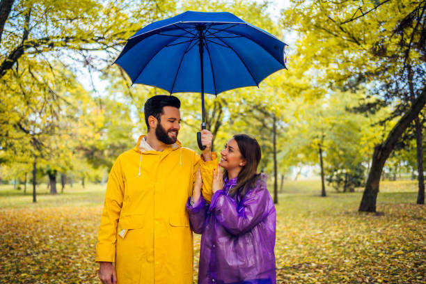 istock Love couple in raincoats 1347535745