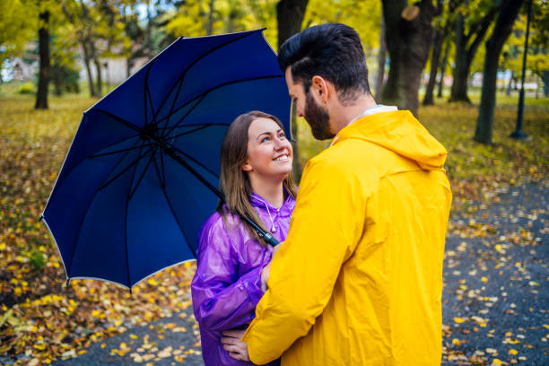 istock Love couple in raincoats 1347535765