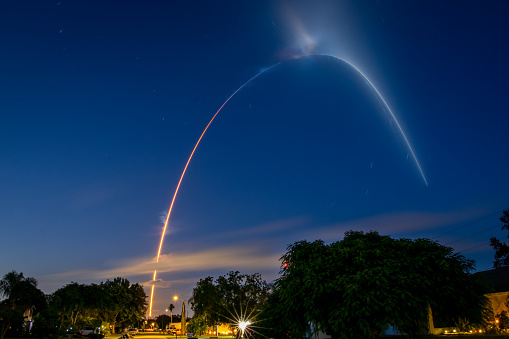 Long exposure streak shot of rocket launch in Florida neighborhood