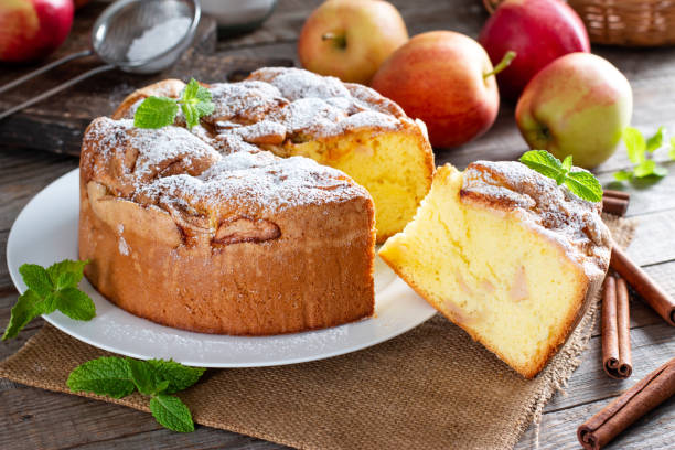 istock Sponge cake or chiffon cake with apples, so soft and delicious with ingredients: eggs, flour, apples on table. Homemade bakery concept for background and wallpaper. 1347539449