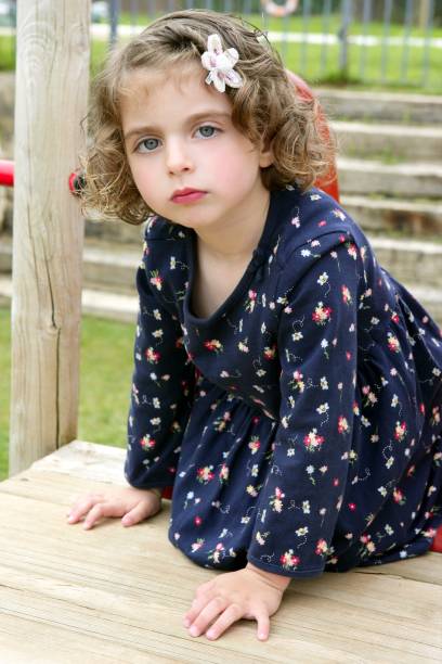istock Little brunette girl playing at the park 1347540465