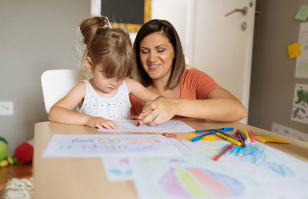 istock Mother and daughter playing and drawing 1347540803