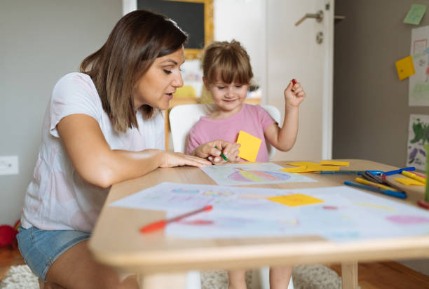 istock Mother and daughter playing and drawing 1347540804