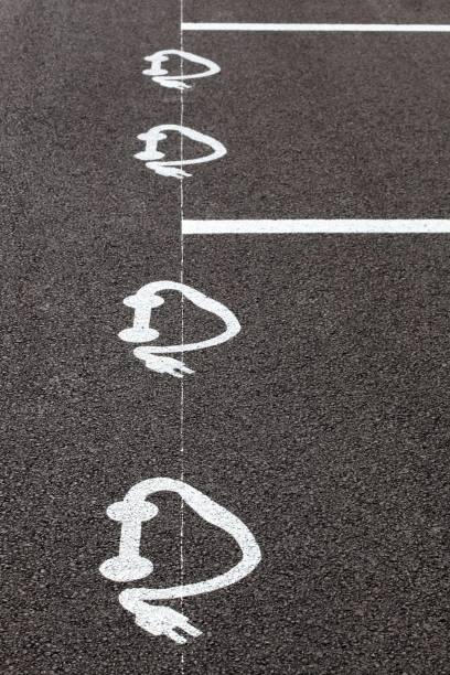 istock Electric car charging symbol on a parking 1347542178