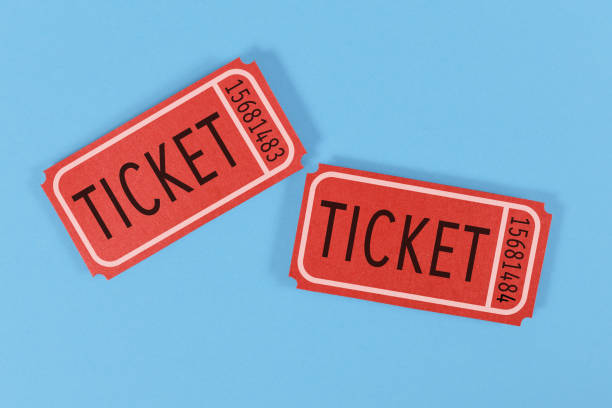 Old fashioned retro tickets Two old fashioned red tickets on blue background ticket photos stock pictures, royalty-free photos & images