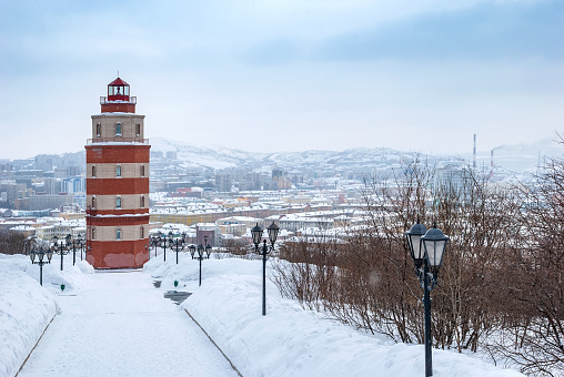 Murmansk city in winter. Lighthouse - a memorial to sailors who died in peacetime. Kola Peninsula.