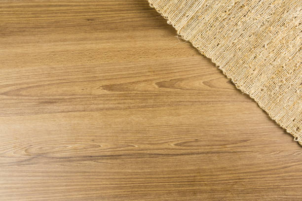 istock Wood texture. Rustic wood with a thin mat with cream threads. Top view 1347546590