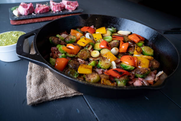 istock Mediterranean Style Vegetable Medley in a Cast Iron Skillet including Brussels Sprouts, Bell Pepper, Onion, Bacon 1347547637