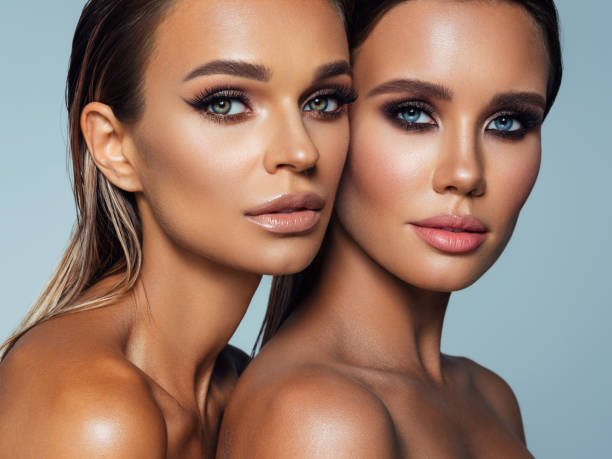istock Two beautiful emotional women with perfect make-up 1347547773