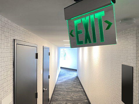 Exit sign in a corridor of residential apartments