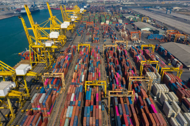 istock Container ship in export and import business and logistics. Shipping cargo to harbor by crane. Water transport International. Aerial view and top view. 1347547950