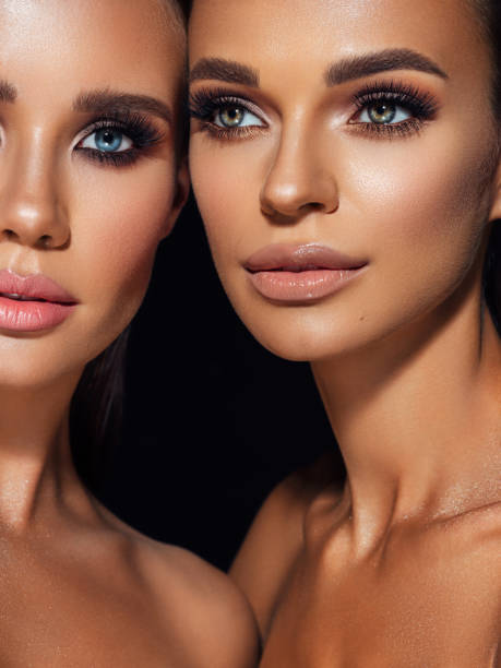 istock Two beautiful emotional women with perfect make-up 1347548040
