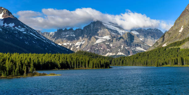 istock Mount Gould - Spring morning clouds hovering over massive and rugged Mount Gould at shore of Swiftcurrent Lake, Glacier National Park. 1347549358