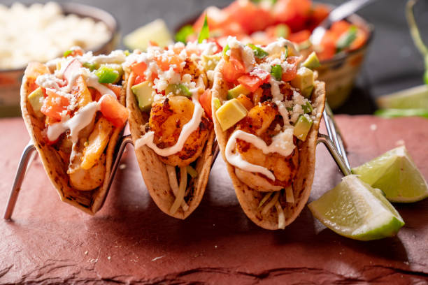 a platter with three gourmet shrimp tacos with mango habanero salsa - healthy eating profile tropical fruit fruit imagens e fotografias de stock