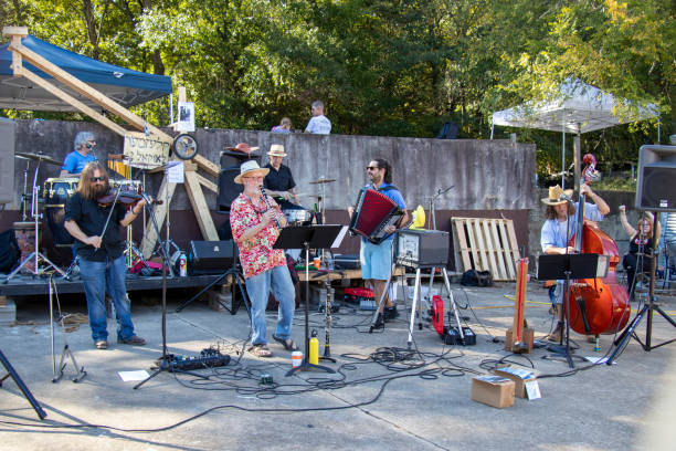 The musical group Klezmer Local 42 plays outdoors at the Jittery Joe's Roaster in Athens, Georgia. Athens, Georgia - October 10, 2021: Klezmer Local 42 plays at the Jittery Joe's Roaster during the Boo-Le-Bark costume contest, a benefit for AthensPets, an area nonprofit that helps shelter pets find permanent homes klezmer stock pictures, royalty-free photos & images