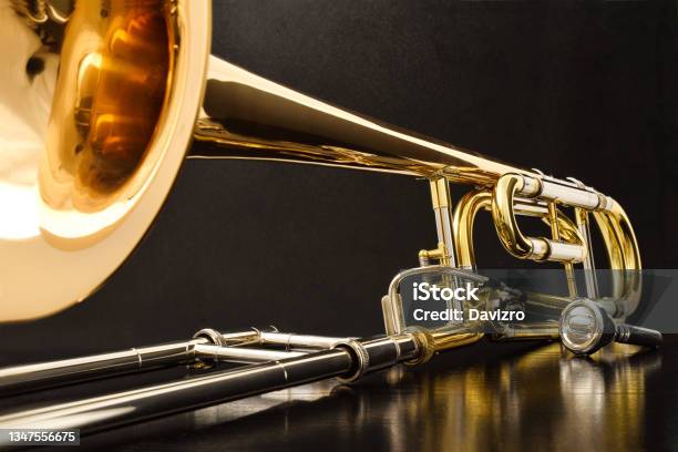 Trombone With Transposer On A Black Table Front View Stock Photo - Download Image Now