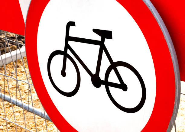 istock No bikes allowed, round red warning biking prohibition sign, simple symbol object detail, closeup, nobody. No bicycles, bikers, cyclists allowed in the area, no cycles, cycling disallowed concept 1347560313