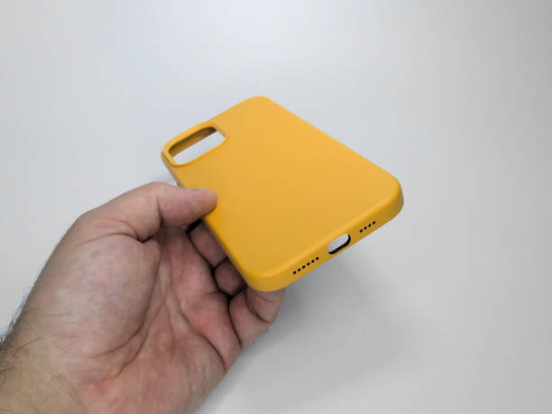 istock A man is holding a yellow smartphone case in his hand 1347562356