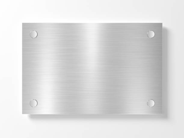 Blank metal nameplate isolated on white wall