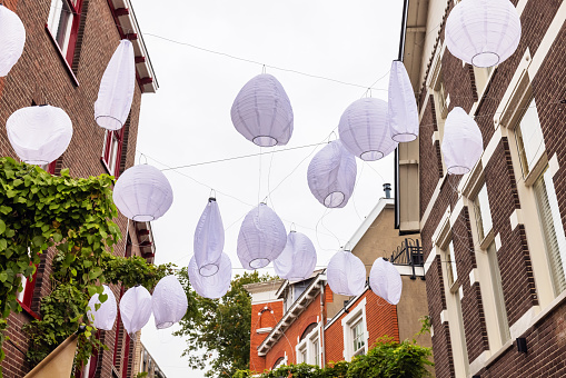 view of a street with paper lanterns in Apeldoorn, Netherlands