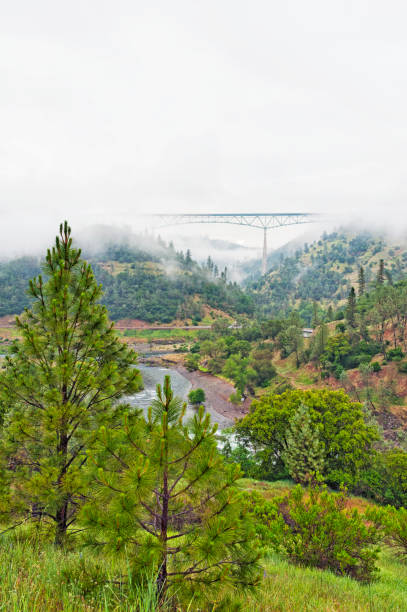 The Foresthill Bridge is Located near Auburn California in Placer County this is the said to be the World's largest Cantilever Bridge above the North Fork American River at 730' it is the highest bridge by deck in California and on this day in May it has a blanket of Fog making this a very scenic picture.