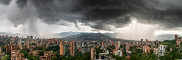 panoramic view of the city of medellin, in colombia, being washed by two storms - valley storm thunderstorm mountain imagens e fotografias de stock