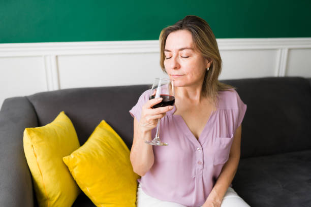 istock Mature woman enjoying wine 1347579040