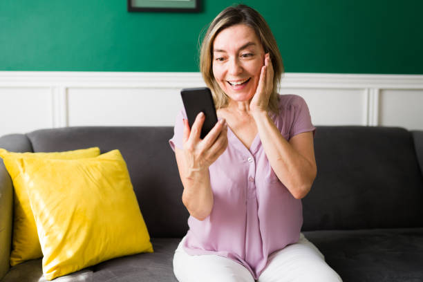 istock Excited senior woman talking on a video call 1347579872