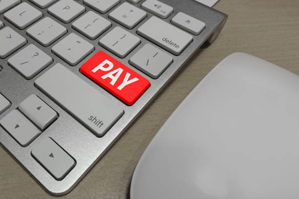 PAY button on computer keyboard stock photo