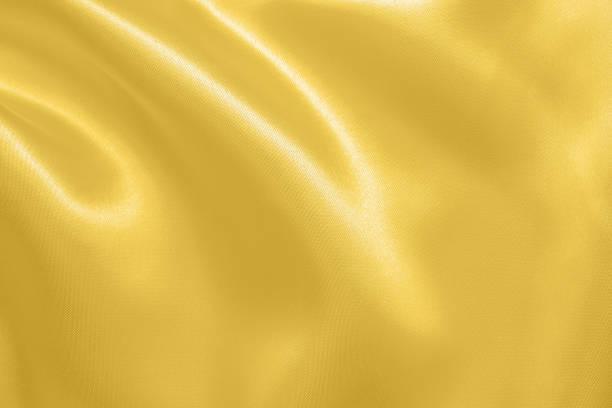 istock Abstract luxury gold fabric with soft wave texture background 1347581740