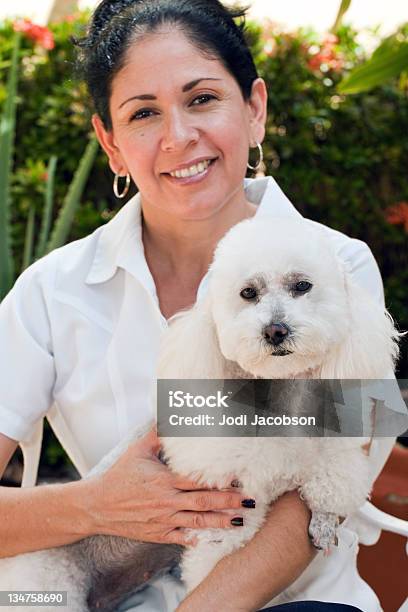 Vet Technician Holding Dog Outside Stock Photo - Download Image Now - Adult, Adults Only, Animal