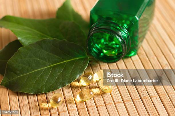 Herbal Supplements Stock Photo - Download Image Now - Alternative Medicine, Bay Leaf, Capsule - Medicine