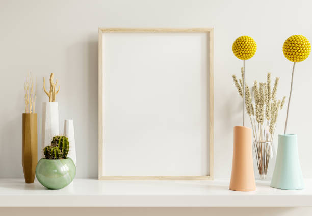 mockup poster con cornice verticale in legno sullo sfondo interno della casa. - shelf wall vase indoors foto e immagini stock