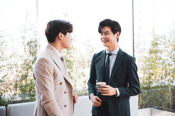 istock Two colleagues discussing business on coffee break 1347595023