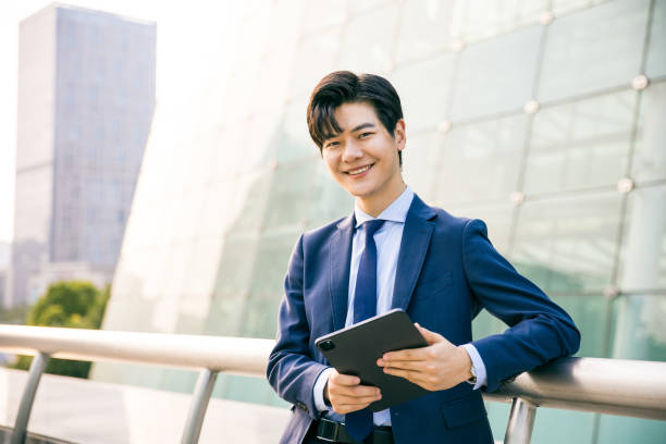 istock Asian businessman portrait outside 1347595241