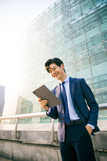 istock Young businessman working with digital tablet outdoor 1347595249
