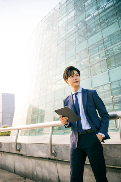 istock Asian businessman portrait outside 1347595256