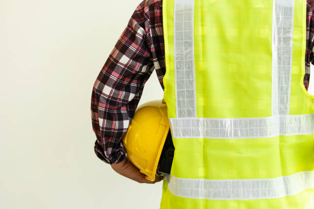 istock engineering concept construction worker holding a yellow hard hat and back view of the architect copy space 1347598365