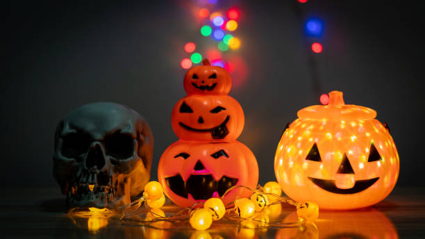 istock Pumpkin skull and scary night lights Halloween decorations 1347598966