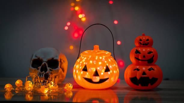 istock Pumpkin skull and scary night lights Halloween decorations 1347599007