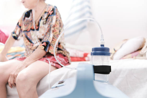 istock oxygen machine in front of female patient in bed 1347600645