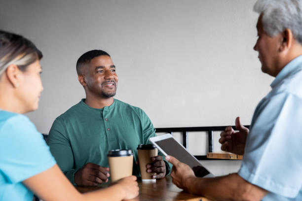istock Diverse colleagues or friends having meeting over coffee 1347607197