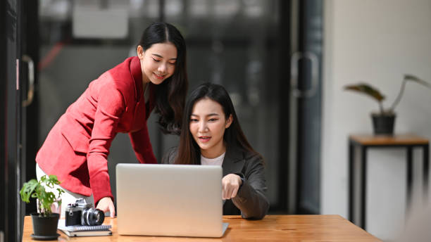 istock Two business women discussing the strategy plan together in office. 1347607814
