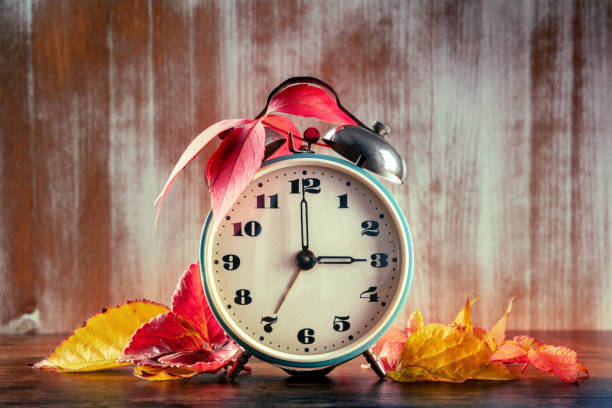 istock Daylight Saving Time concept, fall back in autumn. A vintage alarm clock 1347610524